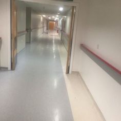 an empty hospital hallway with no people in it