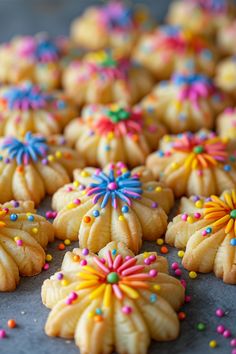 Colorful flower-shaped cookies decorated with vibrant icing and sprinkles. Best Spritz Cookie Recipe, Old Fashioned Cookies, Butter Spritz Cookies, Cookie Press Recipes, Spritz Cookie, Linzer Cookies Recipe, Mini Cheesecakes Easy, Spritz Cookie Recipe, Cookies With Cream Cheese