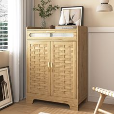 a wooden cabinet sitting next to a window