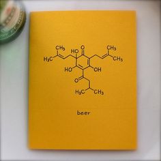 a yellow notebook with the chemical structure of beer on it