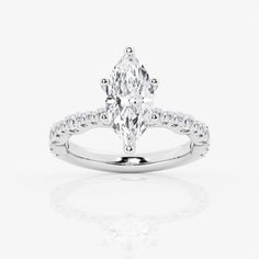 an oval cut engagement ring with diamond accents