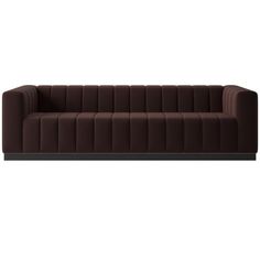 a brown couch sitting on top of a wooden table