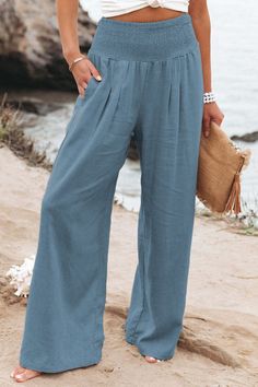 Loose Smocked Traveler Relaxed Boho Vacation High Waist Wide Leg Trousers | Amaryllis – Amaryllis Apparel Stretch Bottoms For Vacation In Solid Color, Vacation Bottoms With Stretch And Solid Color, Vacation Bottoms With Stretch In Solid Color, Stretch Solid Color Bottoms For Vacation, Vacation Stretch Bottoms In Solid Color, Stretch Solid Color Beach Pants, Stretch Solid Color Pants For Beach, Comfortable Summer Bottoms With Pockets, Comfortable Elastic Waistband Summer Bottoms