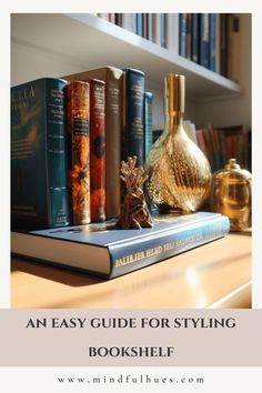 an easy guide for styling bookshelf with gold vases and books on the shelf