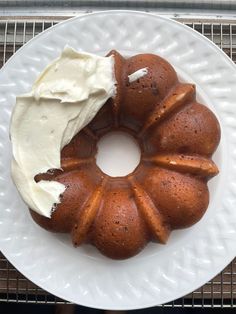 a bundt cake with white frosting on a plate