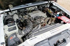 the engine compartment of a car with its hood open