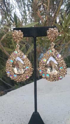 Gold Rhinestone Jewelry For Parties, Gold Jeweled Jewelry For Party, Gold Jeweled Party Jewelry, Glamorous Rhinestone Earrings For Glamorous Events, Gold Crystal Embellished Earrings For Party, Gold Crystal Embellished Earrings, Gold Sparkling Jewelry For Party, Gold Crystal Bridal Earrings For Party, Glamorous Gold Chandelier Earrings With Rhinestones