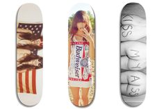 three skateboards with different pictures on them