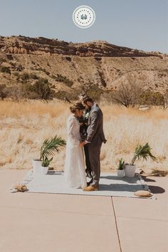 a couple getting married in the desert