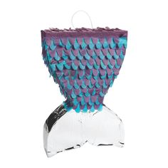 a purple and blue fish tail bag on a white background