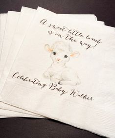 three napkins with an image of a sheep on them