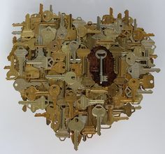 a bunch of keys arranged in the shape of a heart