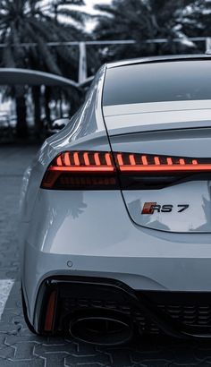 the rear end of a white sports car