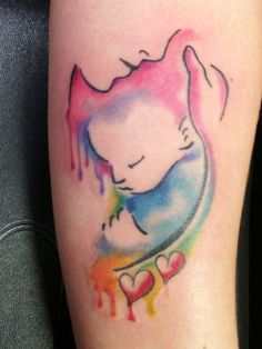 watercolor tattoo on the leg of a woman with a cat and hearts in it