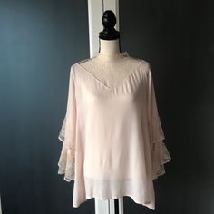 Beautiful Top With Lace Neck Detail And Lace Sleeve Detail. 2 Button Closure In Back Size M Blush Color 100 Rayon Feminine Lace Top Blouse For Layering, Elegant Lace Blouse For Layering, Elegant Flowy Top With Lace Trim, Elegant Flowy Tops For Daywear, Stretch Lace Top Blouse For Layering, Elegant Stretch Blouse For Daywear, Feminine Blouse With Lace Trim For Layering, Feminine Blouse For Spring Layering, Feminine Stretch Blouse For Layering