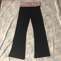 Vs Sport Most Loved Bootcut Yoga Pant Black With Pink And Gold Fold Over Waist Size Small. These Are Very Similar To The Original Most Loved Yoga Pants. Very Soft And Comfy 52% Cotton, 12% Elastic, 18% Modal 18% Polyester. These Are Almost Brand New I Wore Them Less Than Ten Times, No Stains Or Holes And No Fading Vs Sport, Yoga Pant, Victoria Secret Sport, Fold Over, Waist Size, Victoria Secret, Yoga Pants, Victoria’s Secret, Pink And Gold