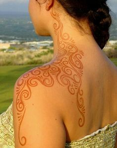 a woman with a tattoo on her back