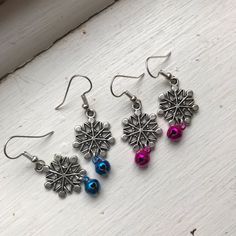 Bring Some Jingle To Your Holiday Celebrations With This Set Of Two Handmade Snowflake Earrings, Each Adorned With A Vibrant Bell Charm In Blue And Magenta. Perfect For Spreading Holiday Cheer, These Lightweight Earrings Combine Festive Sparkle With A Touch Of Fun, Making Them A Delightful Addition To Your Seasonal Wardrobe Or A Thoughtful Gift For Someone Special. Sold Together As A Pair, They're Ready To Add A Little Extra Charm And Music To Your Winter Days! 1 3/4 Inches Let The Jingle Bells Holiday Beaded Jewelry, Diy Christmas Earrings, Christmas Earrings Handmade, Christmas Jewelry Diy, Bell Earrings, Holiday Beading, Winter Earrings, Handmade Jewlery, Holiday Earrings