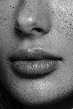 a woman with freckles on her face and nose