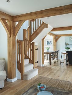 a living room filled with furniture and wooden floors