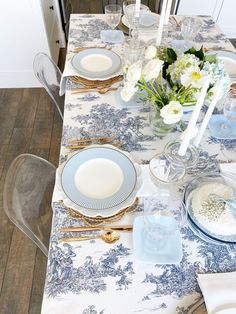 the table is set with blue and white china