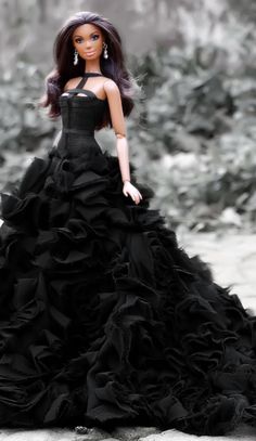 a barbie doll dressed in a black dress