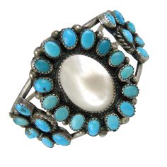 Stunning Pawn Mother of pearl Center with Turquoise insets with a Double wire cuff. Measuring 1.78in. top to bottom x 1.45in. wide. Will fit a 6.5 in. to 7.5 inch wrist nicely. It can be fitted smaller or a bit larger. The opening is 1 inch. This is out of a massive collection of Contemporary designer clothing as well as Hopi, Zuni, Navajo, Southwestern, sterling silver, costume jewelry and fine jewelry from one collector. Be sure to check our storefront for more fabulous pieces from this collec Vintage Turquoise Jewelry, Silver Costume, Wire Cuff, Pretty Fashion, Mother Pearl, Fantasy Jewelry, American Jewelry, Sterling Silver Bracelet, Native American Jewelry