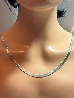 This is a beautiful, vintage, genuine Milor sterling silver herringbone necklace that is made in Italy. The necklace is about 30 inches. The chain is unisex - for a man or woman. It is increasingly difficult to find these vintage sterling silver herringbone chains in the larger lengths like this. The necklace is about 1/4" in width and is very well-made and striking when worn. The chain weighs about 19.2 grams and is stamped Milor 925 Made in Italy. It also has been tested and is sterling silver Classic Sterling Silver Herringbone Necklace As Gift, Silver Snake Chain Jewelry For Anniversary, Sterling Silver Herringbone Necklace With Silver Chain Gift, Silver Herringbone Necklace Gift, Anniversary Snake Chain Necklace, Mens Vintage Jewelry, Herringbone Necklace, Handmade Artisan, Necklace Chain