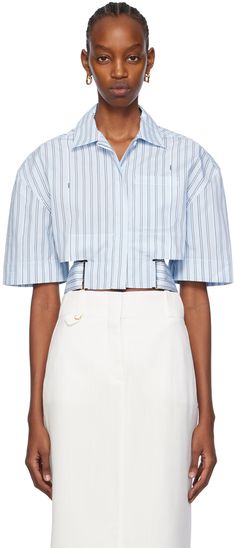 Cotton poplin shirt. Jacquard logo pattern and stripes throughout. · Spread collar · Concealed button closure · Patch pocket · Cutouts at waist · Integrated adjustable button belt at cropped hem · Dropped shoulders · Locker loop at back collar · Logo-engraved hardware Part of the Les Sculptures collection. Supplier color: Print blue stripe Summer Office Shirt With Striped Collar, Designer Summer Tops With Buttons, Designer Shirt With Placket For Spring, Blue Striped Shirt, Shirt Detail, Cotton Poplin Shirt, Logo Pattern, Pocket Shirt, Poplin Shirt