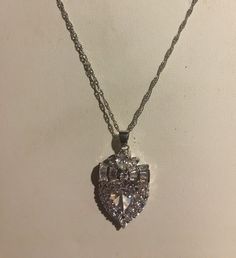 "BOLD Clear CZ Heart Shaped Pendant with Clear CZ's around and it is sparkling! is on an 18\" Sterling Silver necklace. The Pendant is 1 1/4 \" high and almost 1 \" wide. Dazzling and sparkly Can wear to so many functions Please ask any questions as I do not accept returns! Thank You" Heart Cut Cubic Zirconia Party Necklace, Heart Cut Cubic Zirconia Necklaces For Party, Heart Cut Cubic Zirconia Party Necklaces, Heart Cut Cubic Zirconia Necklace For Party, Silver Heart-shaped Cubic Zirconia Rhinestone Necklace, Silver Cubic Zirconia Rhinestone Necklace For Valentine's Day, Valentine's Day Sparkling Cubic Zirconia Necklaces, Valentine's Day Sparkling Cubic Zirconia Necklace, Heart-shaped Cubic Zirconia Rhinestone Necklace As Gift