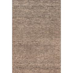 an area rug with brown and white squares on the front, in shades of beige