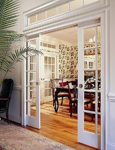 an open door leading to a dining room