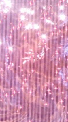 an image of some pink stars in the sky