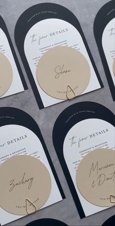 the wedding stationery is laid out on top of each other for guests to sign