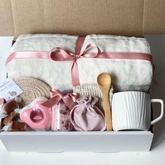 a white box with pink items in it