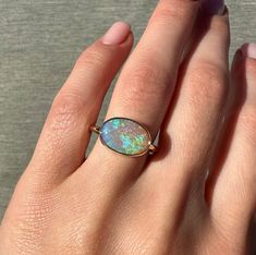 14K Yellow gold ring with Australian Crystal Opal Size: 7.75 Opal size: 12.5×8.5mm (2.9 ct) Metal: 14K yellow gold Band: 1.5mm round Stones: Australian opal (natural untreated stone) High Luster Oval Ring In 14k Gold, High Luster 14k Gold Oval Rings, 14k Gold Rings With High Luster For Gift, 14k Gold High Luster Rings As A Gift, High Luster 14k Gold Rings For Gift, Oval 14k Gold High Luster Jewelry, Oval 14k Gold Jewelry With High Luster, Australian Opal Ring, Crystal Opal