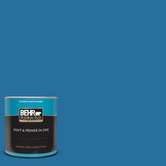 a can of behr paint on a blue background