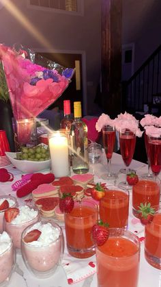 a table topped with desserts and drinks