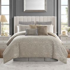 a bed in a bedroom with gray walls