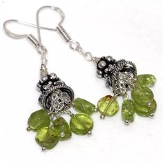 Traditional Ethnic Style Sterling Silver Plated Earrings With Solid Sterling Silver Hooks. Handmade With Multiple Natural Peridot Gemstones. 2 Inches Long. Will Be Energetically Charged By A Reiki Master Silver Natural Stones Fusion Earrings, Silver Fusion Earrings With Natural Stones, Silver Peridot Drop Earrings, Silver Dangle Peridot Earrings, Silver Peridot Dangle Earrings, Gear Earrings, Glass Drop Earrings, Peridot Earrings, Bohemian Handmade