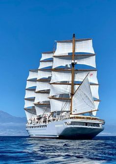 a large white ship sailing in the ocean