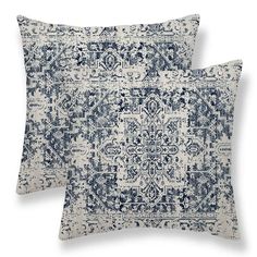 two pillows with blue and white designs on them