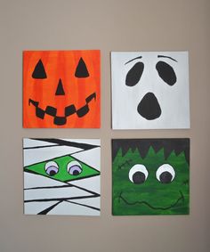 four square paintings with faces painted on them in different colors and shapes, each decorated as a halloween jack - o - lantern