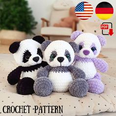 three crochet panda bears sitting next to each other on top of a bed