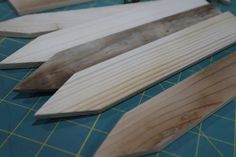 several pieces of wood sitting on top of a cutting board