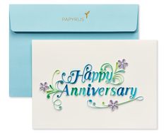 a card with the words happy anniversary written on it and an envelope that has a blue envelope