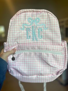 These custom embroidered backpacks are adorable for your little one and the perfect size for a diaper bag or daycare/preschool! Add an optional motif for $8 by adding this listing to your cart: https://www.etsy.com/listing/1765520747/motif-add-on-for-backpacks  Details: - One zipper pocket in the front as well as small pockets on either side of the backpack. - Size: 13" long x 10" wide x 3.5" deep Preppy Backpack For Daily Use, Preppy Backpack For School Events, Cute Gingham Bags For Gifts, Personalized Preppy Bags For Everyday Use, Preppy Personalized Bags For Everyday Use, Preppy School Event Bag For Back To School, Preppy Personalized Standard Backpack, White Preppy Backpack, Preppy Personalized Backpack For Back To School