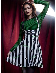 Live your best strange and unusual life with the help of your favorite ghost! You'll be crawling with style in this Beetlejuice suspender skirt. Features a toss print of bugs, sandworms and the movie's title on a thick black & white striped print. This suspender skirt curves under the bust and comes with decorative faux leather buckles. Complete with adjustable, crossed suspender straps on the back and hip pockets. Beatle Juice Red Dress, Beetlejuice Outfits, Beetlejuice Halloween Costume, Beetlejuice Costume, Beetlejuice Halloween, Strange And Unusual, Group Halloween Costumes, Suspender Skirt, Halloween Disfraces