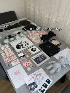 the table is covered with many different items and papers that are on top of it