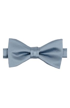 Bring versatility and distinction to any formal look with this pre-tied bow tie crafted in a solid color from smooth and silky satin. 2 1/4" width 22" length Pre-tied; adjustable 100% polyester Dry clean Imported Classic Pre-tied Satin Bow Tie, Classic Adjustable Solid Color Bow, Classic Adjustable Solid Bow, Classic Adjustable Satin Bow Tie, Classic Solid Color Bow With Ties, Classic Solid Bow Tie, Classic Solid Suit And Tie Accessories With Decorative Bow, Solid Black Tie With Decorative Bow, Classic Pre-tied Satin Bow